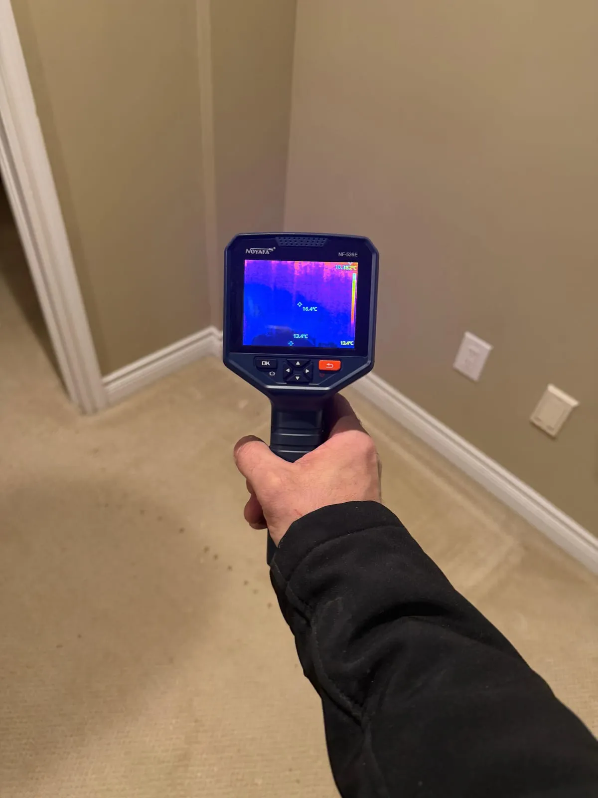 Thermal camera checking for water under carpet and behind baseboards